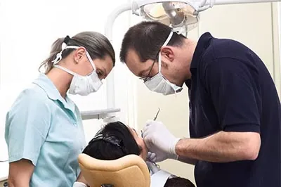 Dr. Alex Martin providing emergency dental care for a patient
